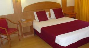 Cama ou camas em um quarto em Hotel Solneve