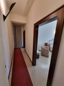 a hallway with a door open to a room at Casa Zia Cianetta Residenza di Campagna in Capodacqua di Foligno