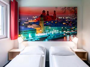 Postel nebo postele na pokoji v ubytování B&B Hotel Passau