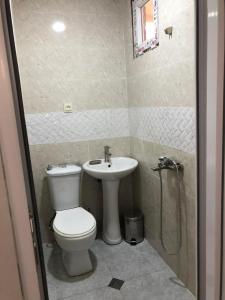 a bathroom with a toilet and a sink at Chaki 2 in Ureki +19 photos