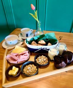 a table with a tray of food on a table at Bungalow Miramar & Jeronimo at Casa Marin Vineyards in Cartagena