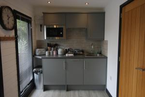 a kitchen with a sink and a counter top at Lakeside Lodges in Leicester