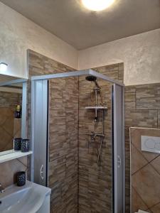 a bathroom with a shower and a sink at Centro Mezzano Romantica, affitto camere in Mezzano