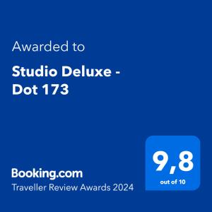 a blue phone screen with the text awarded to studio deluxe do at Studio Deluxe - Dot 173 in Campinas