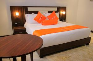 Łóżko lub łóżka w pokoju w obiekcie Lemaiyan Suites