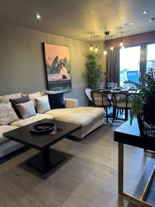 a living room with a couch and a table at Tunnage Square Apartments Duke St by EPIC in Liverpool