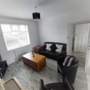 a living room with a couch and a coffee table at Havendene in Haworth +25 photos