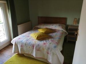Кровать или кровати в номере Gite du Colombier