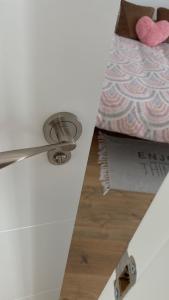 a white ceiling with a bed and a drawer at Palace Residence - Habitación en apartamento in Granada +21 photos