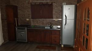 Kuchyň nebo kuchyňský kout v ubytování Cabañas EL PATO Coronda Santa fe