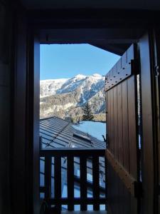 a view of a mountain from a window at Mansarda trilocale direttamente sulla pista a Folgarida - Belvedere in Folgarida