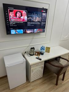 TV a/nebo společenská místnost v ubytování Boutique NABIBEK