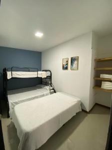 A bed or beds in a room at Tranquilo, Central y acogedor