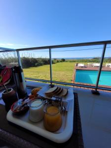 a tray of food on a table on a boat at Audencia del Mar in La Paloma