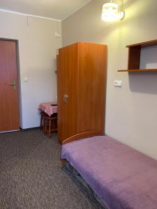 Postel nebo postele na pokoji v ubytování Willa Pod Górami