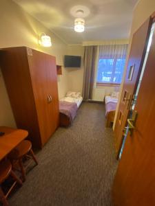 Postel nebo postele na pokoji v ubytování Willa Pod Górami