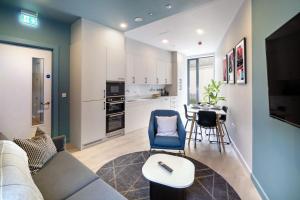 a living room with a couch and a table at Stoneybatter Place in Dublin