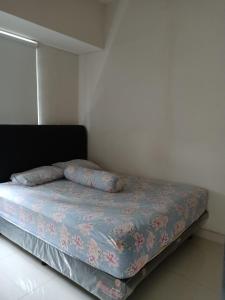 A bed or beds in a room at IjenBromo Hub Omyah Isun Hub