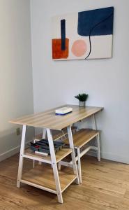 a wooden desk with a book on top of it at Urban Nest, Studio, Ground Floor in Halifax