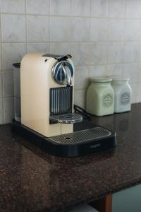 a toaster sitting on top of a kitchen counter at Zima Two Seaside in Zygi