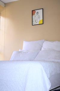 Ένα ή περισσότερα κρεβάτια σε δωμάτιο στο Executive affordable apartment