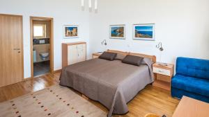 Posteľ alebo postele v izbe v ubytovaní Nautilus-Bay Steinhaus im Dorf von Zavala für 2-7 Personen, 3 Schlafzimmer