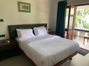 Llit o llits en una habitació de Beach Haven, Kappad Beach - Kozhikode