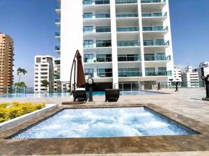 a swimming pool in front of a building at 19TH FLOOR LUXURY APARTMENT BAY VIEW CARTAGENA in Cartagena de Indias