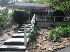 a house with a white fence and stairs in front of it at Serenity Hill Bed and Breakfast in Sloans Crossing