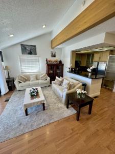 a living room with a couch and a table at 1899- Knotty Pine - Big Bear Lake Retreat home in Big Bear Lake