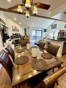 a dining table and chairs in a living room at 1899- Knotty Pine - Big Bear Lake Retreat home in Big Bear Lake