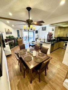 a kitchen and dining room with a table and chairs at 1899- Knotty Pine - Big Bear Lake Retreat home in Big Bear Lake