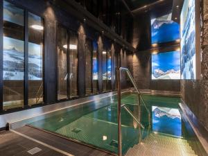 a swimming pool in a building with windows at Chalet Avoriaz, 7 pièces, 14 personnes - FR-1-314-96 in Avoriaz
