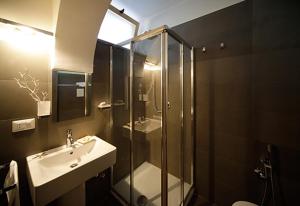 a bathroom with a shower and a sink and a toilet at Castellabate House in Santa Maria di Castellabate