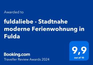 Ett certifikat, pris eller annat dokument som visas upp på fuldaliebe - Stadtnahe moderne Ferienwohnung in Fulda