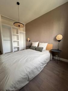 Postel nebo postele na pokoji v ubytování LA BELLE ESCALE