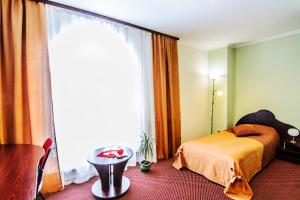 Postel nebo postele na pokoji v ubytování Terminal-A Hotel