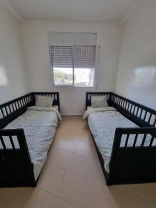 Ένα ή περισσότερα κρεβάτια σε δωμάτιο στο Appartement propre et soigné