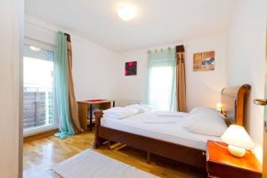 Ένα ή περισσότερα κρεβάτια σε δωμάτιο στο Deluxe Trsje Apartments