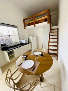 a dining room with a table and a bunk bed at DuPai Sorocaba in Sorocaba
