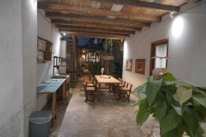 a dining room with a table and chairs at Thoai Mai House Phan Thiết in Ấp Bình Hưng