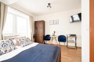 Posteľ alebo postele v izbe v ubytovaní Pokoje u Kamińskich 26E