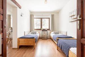Posteľ alebo postele v izbe v ubytovaní Pokoje u Kamińskich 26E
