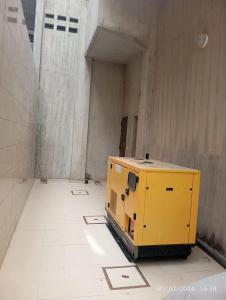 a yellow box sitting on the floor of a building at Timba Deluxe in Cotonou