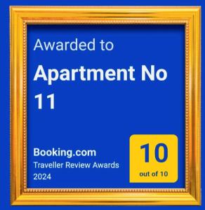 een fotolijstje met een bord waarop staat toegekend aan afspraak no bij Apartment No 11 in Subotica