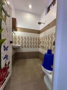 a bathroom with a toilet and a sink at PUNNAMADAKKARAN CRUISE in Alleppey