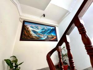 a television hanging on a wall in a stairway at Taleju Grand Hotel in Bhaktapur