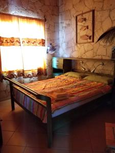 Un pat sau paturi într-o cameră la Residenz Stella Maris Apartment Strela