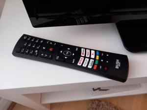 a remote control sitting on top of a table at 1 Bed Bognor Apartment 300 yrds from beach in Bognor Regis