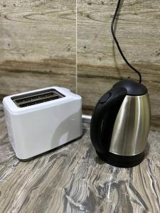 a black and white toaster sitting next to a toaster at Havengate Homestay in Butterworth